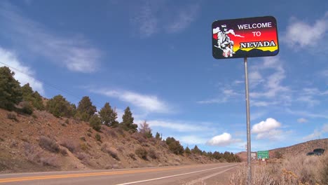 a sign welcomes visitors to nevada 2