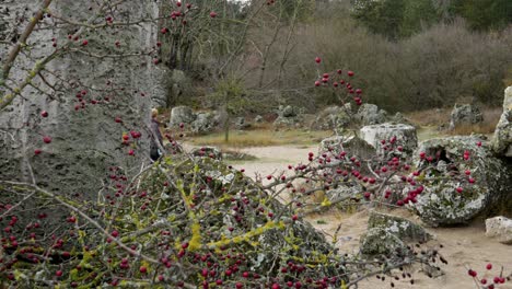 Lone-woman-wanders-through-unique-rock-formations-at-pobati-kamani