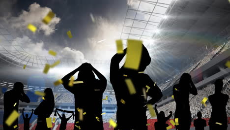 golden confetti falling over silhouette of disappointed fans against sports stadium