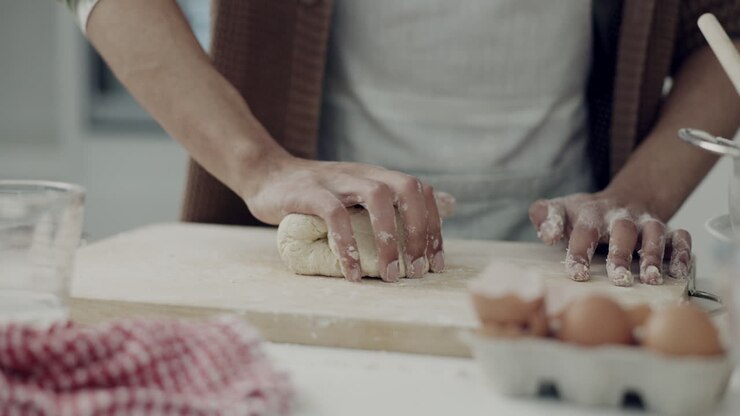 Bread, kitchen and hands baking with dough press