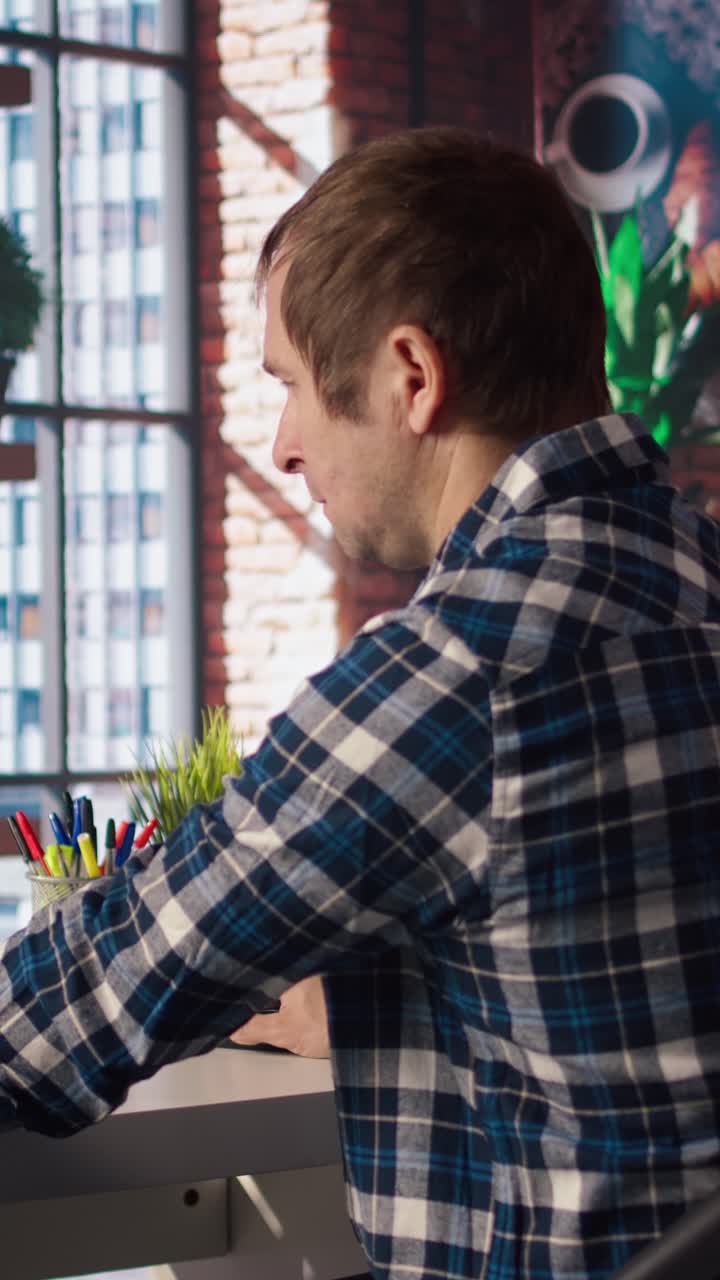 Vertical video Man having fun interacting with AI LLM chatbot PC GPT software on PC