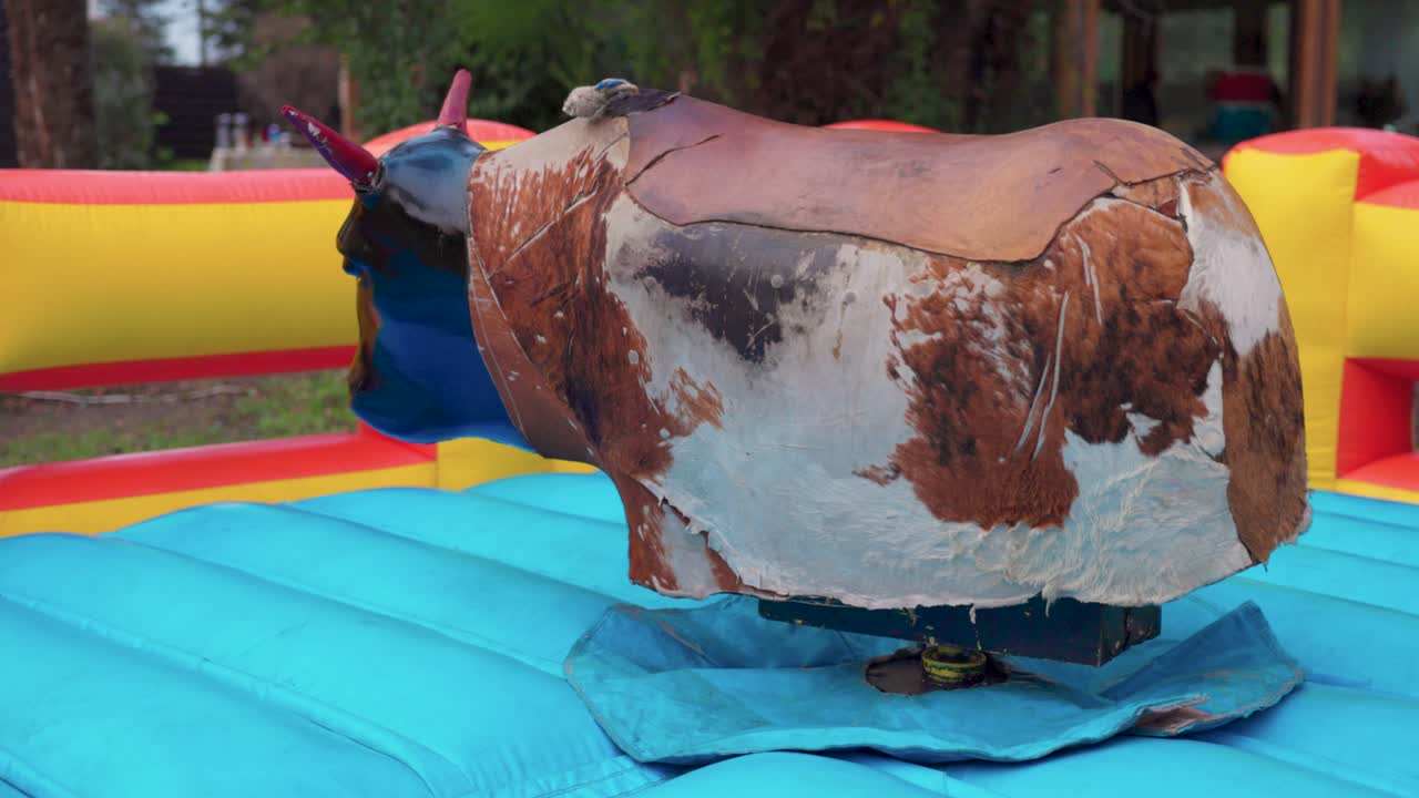 Mechanical bull Fiestas Patrias chile pennant stars santiago sky grass elements red blue white