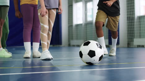 kid kicking soccer ball