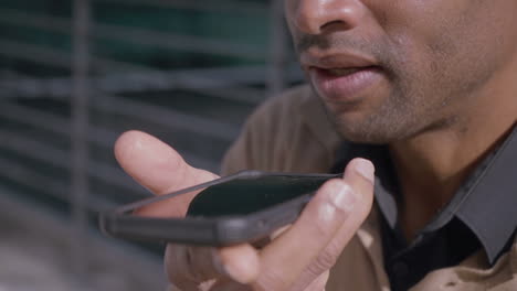 african american man having audio conference on phone