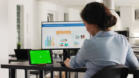 Analyst working at office desk