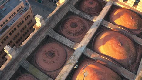 aerial revealed malaga cathedral and cityscape near port in andalusia, spain