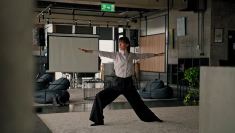 woman stretching in modern office