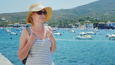 a woman rests by the sea near cadaques in catalonia 4