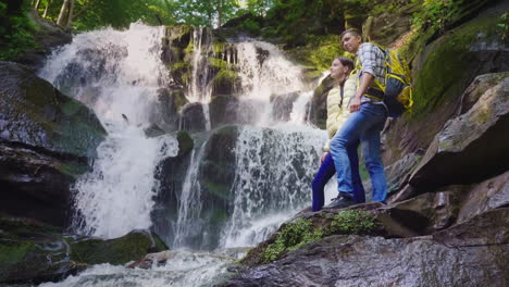 A-Beautiful-Waterfall-In-The-Mountains-Water-Flowing-Over-The-Rocks