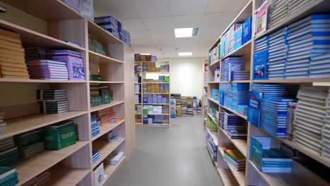 empty library at the university. rows of different colorful books lying on the shelves