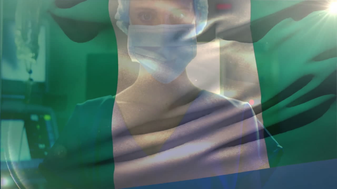 Professionista sanitario con maschera e bandiera nigeriana, che simboleggia la dedizione medica.