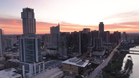 Wide-aerial-view-of-downtown-Austin,-Texas-skyline-and-Colorado-River-at-sunrise