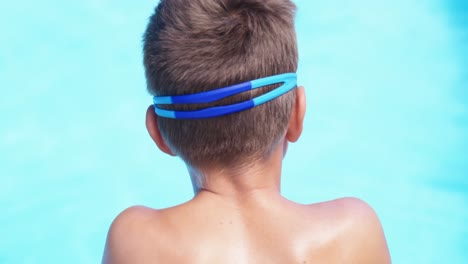 boy relaxing near poolside