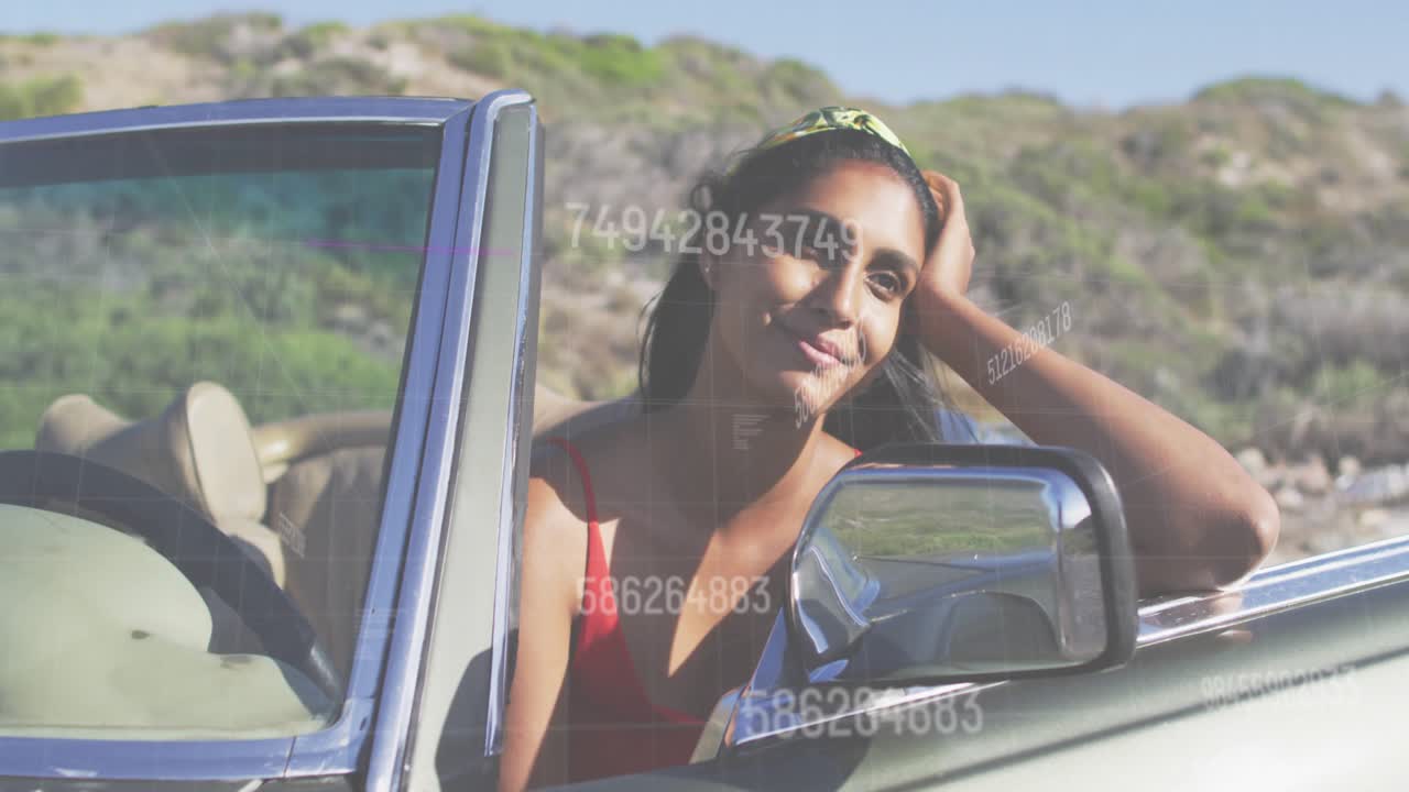 Woman leaning in car, watching numbers appearing and drifting across face and mirror, showing tech