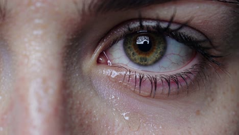 close-up of an eye with captivating detail showcasing tears and intricate colors at a serene moment of emotion