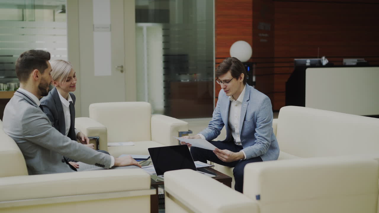 Business Meeting in Office Lobby