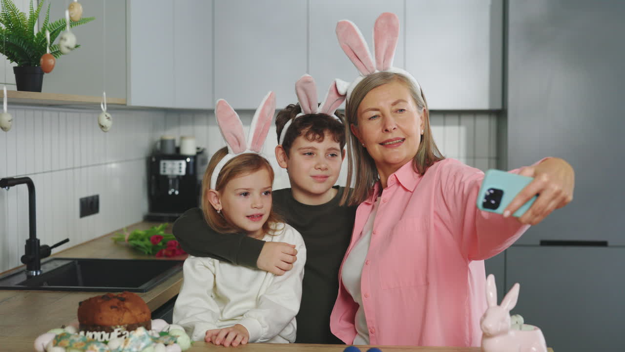 Grandmother and Grandchildren Take Easter Selfie in Kitchen