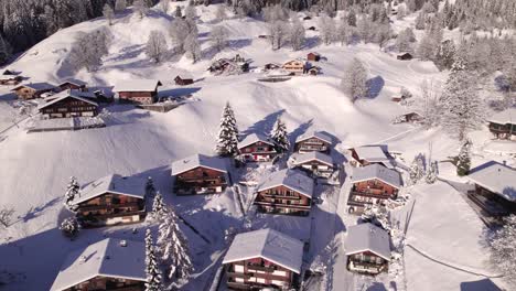 pushing in towards snowy chalets in picturesque swiss mountain village grindelwald