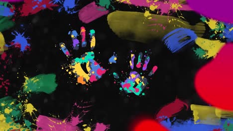 Animation-of-multi-coloured-hand-prints-over-splashes-of-paint-on-black-background