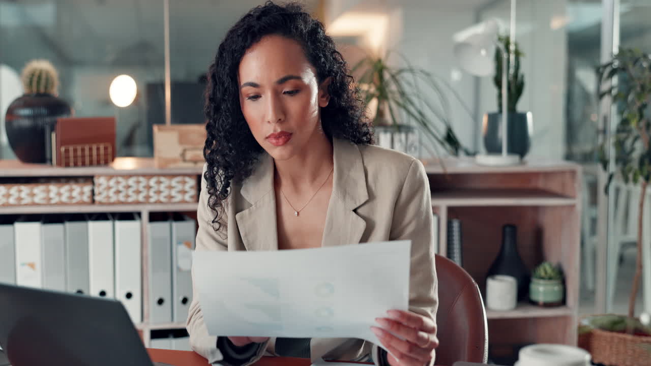 Businesswoman working on laptop in office