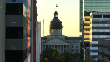 Skyscrapers-in-downtown-Columbia,-SC-revealing-South-Carolina-State-House-during-sunrise