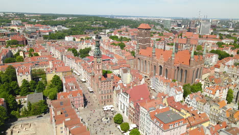 People-tourists-walking-along-Gdansk-Old-Town-streets---Aerial-pull-back