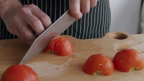 chef cutting tomatoes on a board
shot at 100fps 2