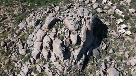 Aerial-top-down-view-of-small-town-in-the-Arizona-desert-landscape,-hotel-resort