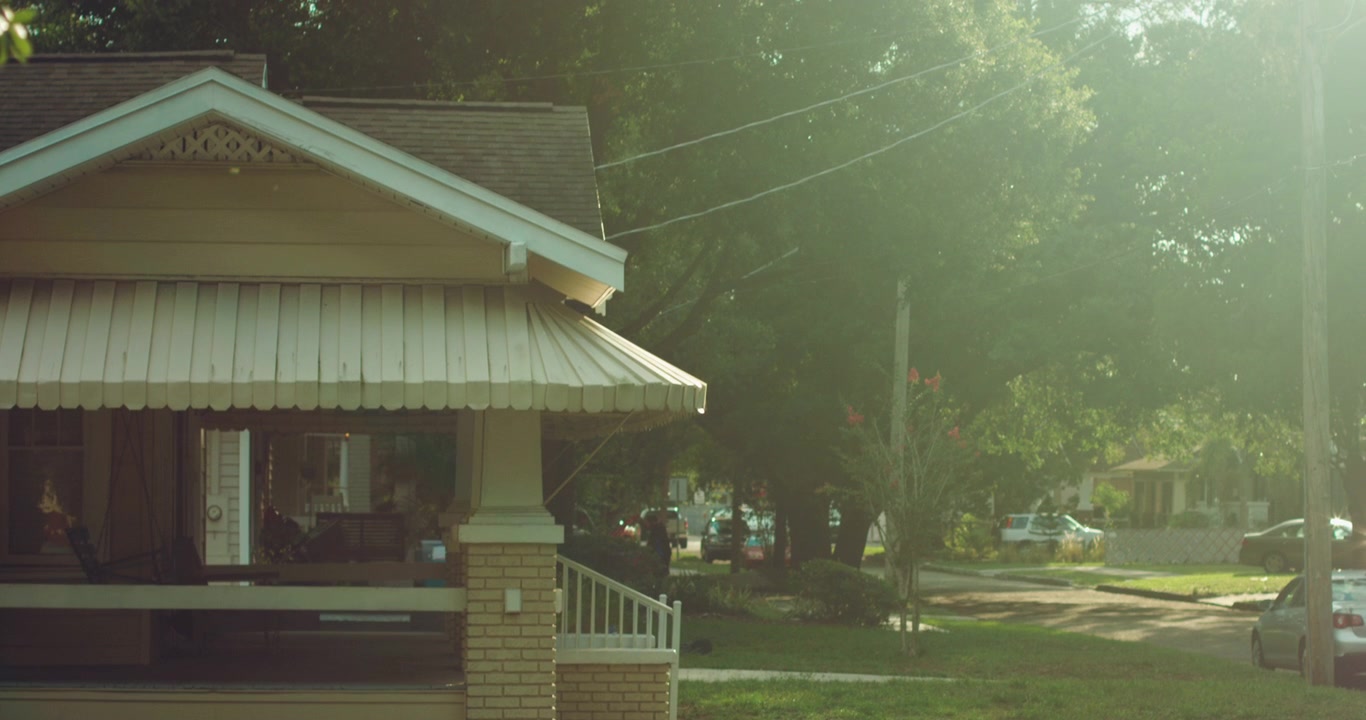 Sun shines on bungalow in neighborhood