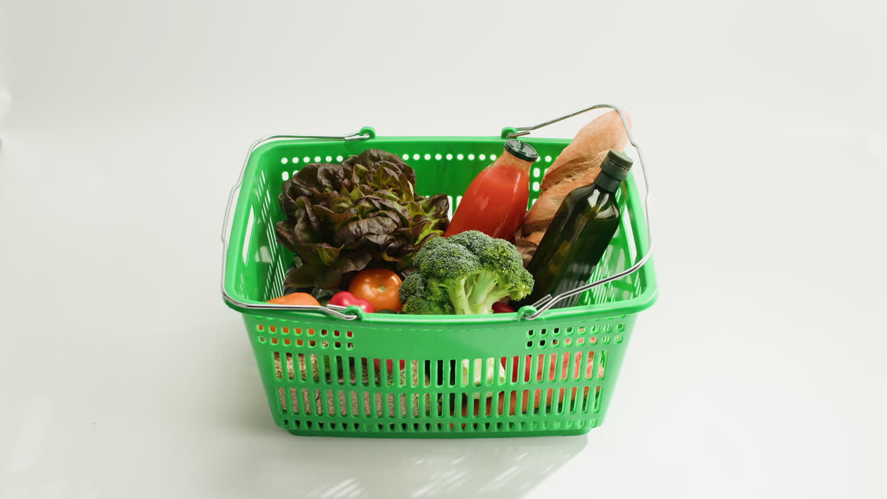 Woman shopping with a basket filled with groceries