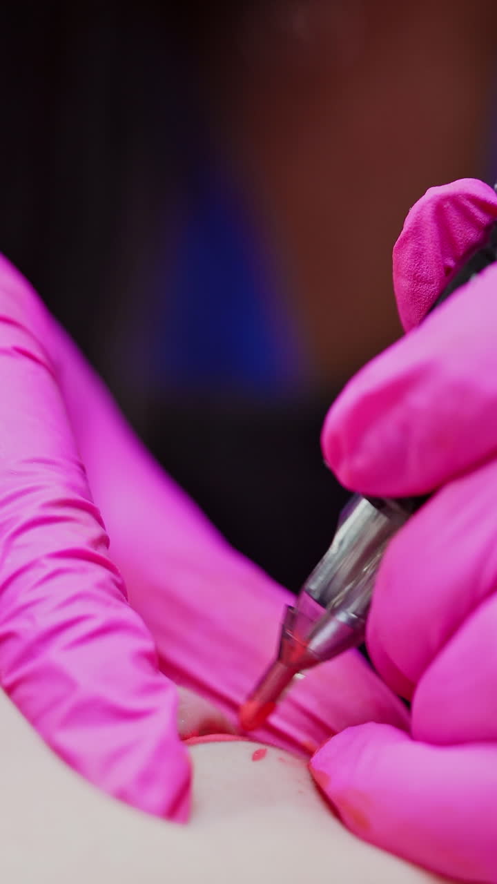 Close up view of cosmetological procedure. Professional tattooist making permanent makeup