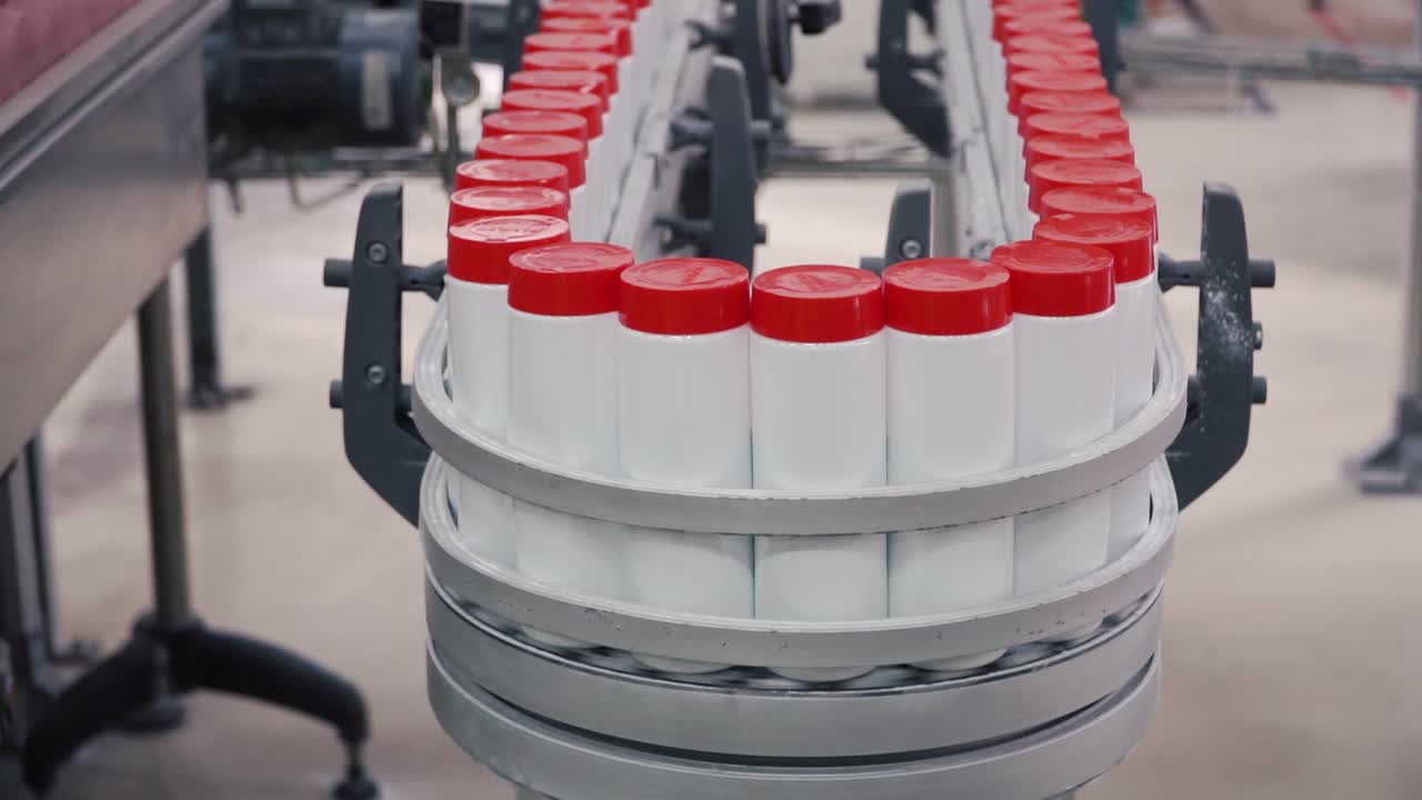 Bottles on a Conveyor Belt in a Production Facility