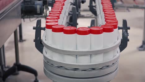 bottles on a conveyor belt in a production facility