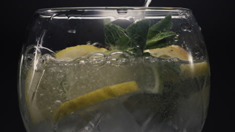 fizzy lemon ice mint cocktail closeup. preparing fresh lemonade drink concept