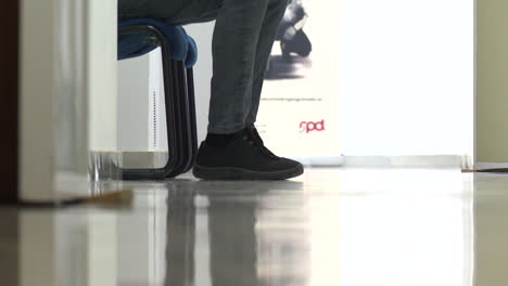 person sitting in an office waiting room