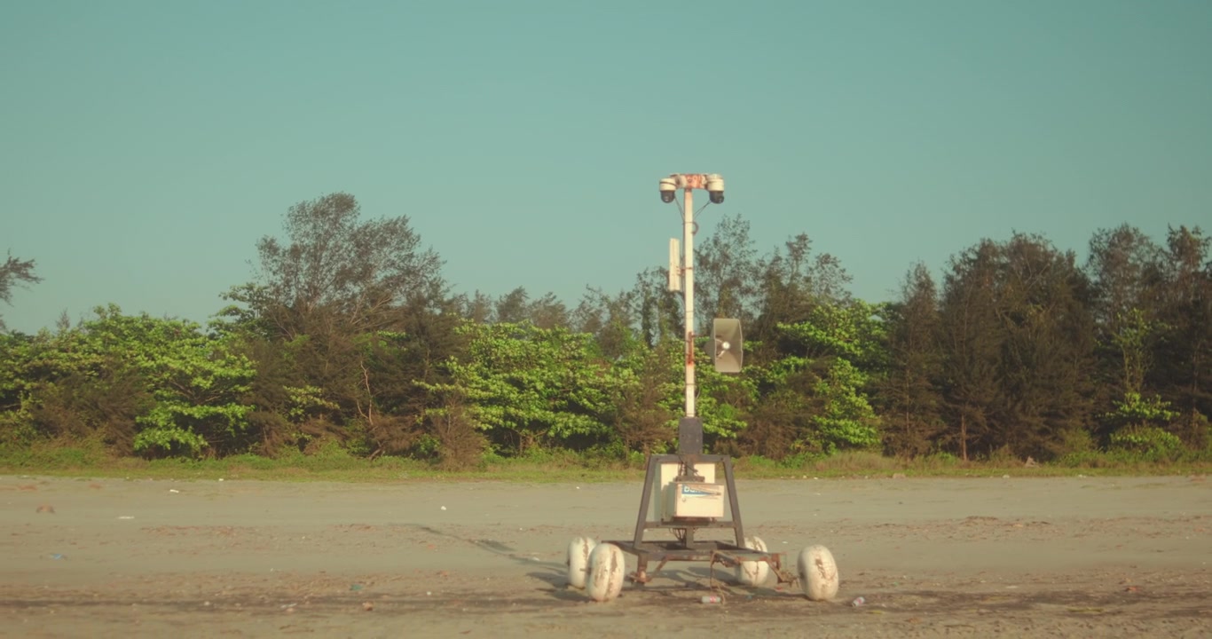 Solar powered mobile robotic surveillance system with multiple cameras monitoring a sandy beach and coastal forest, delivering autonomous environmental and public safety protection via smart sensors