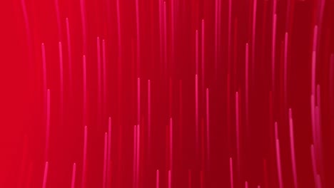 Animation-of-pink-light-trails-falling-against-copy-space-on-red-background