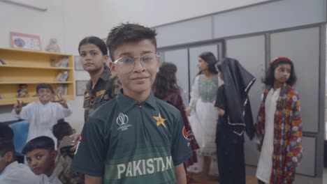 pakistani children celebrate independence day in a classroom, showing cultural pride and unity with smiles and traditional attire, capturing national spirit and youthful enthusiasm