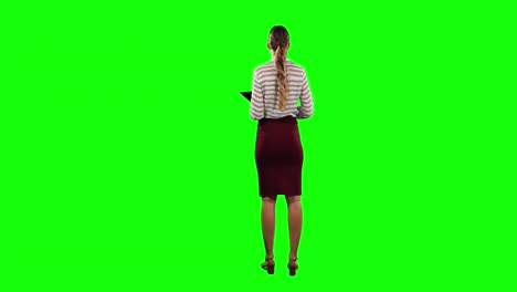 Rear-view-of-a-woman-holding-a-digital-tablet-with-green-screen-