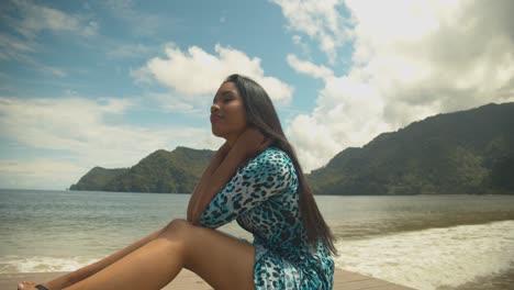 female model having fun and posing for the camera on a jetty on the caribbean island of trindad