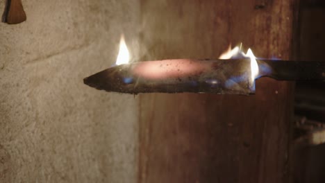 forged metal knife on fire