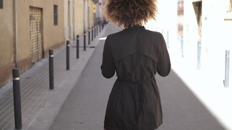 Stylish young woman on street