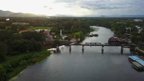 scenic aerial view of kanchanaburi's iconic bridge over the river