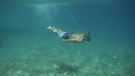 man snorkeling underwater