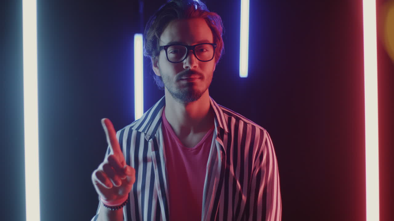 Man in a Striped Shirt with Neon Lights