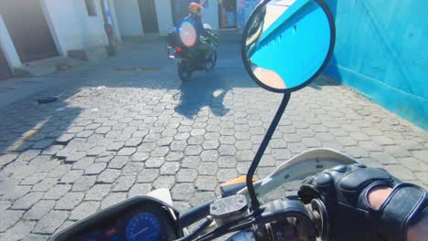 motorcycle riders stop to ask child for directions inner city guatemala