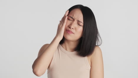 asian woman looking worried on camera.