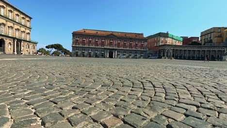 cobblestone street with historic buildings in naples