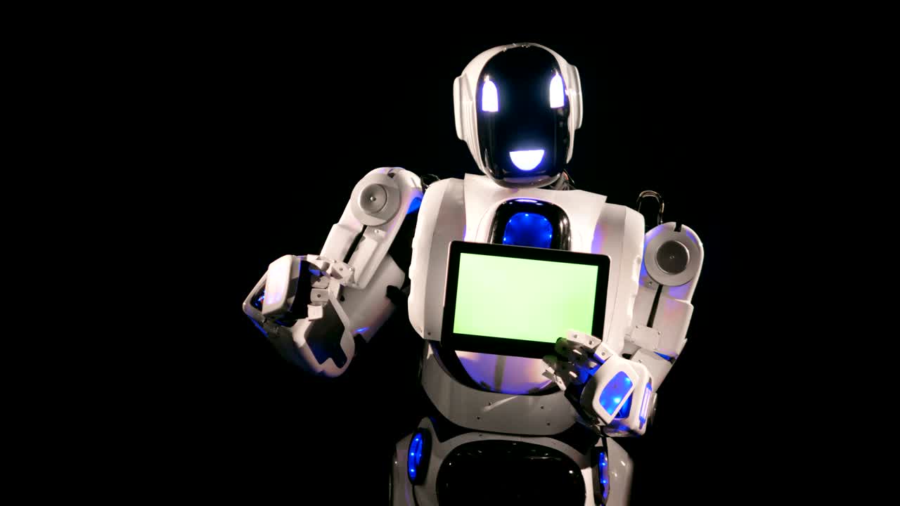 el nuevo robot apunta a la tabla de chromakey en sus manos.