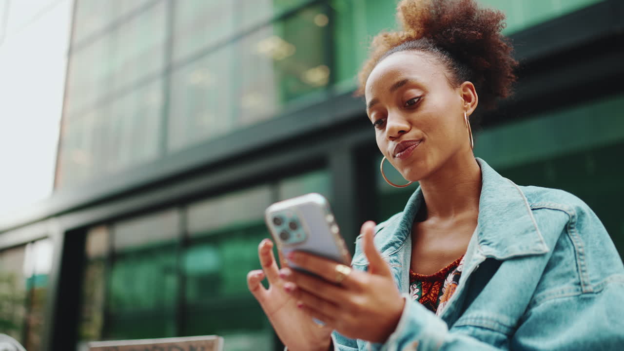 Woman using her phone outdoors